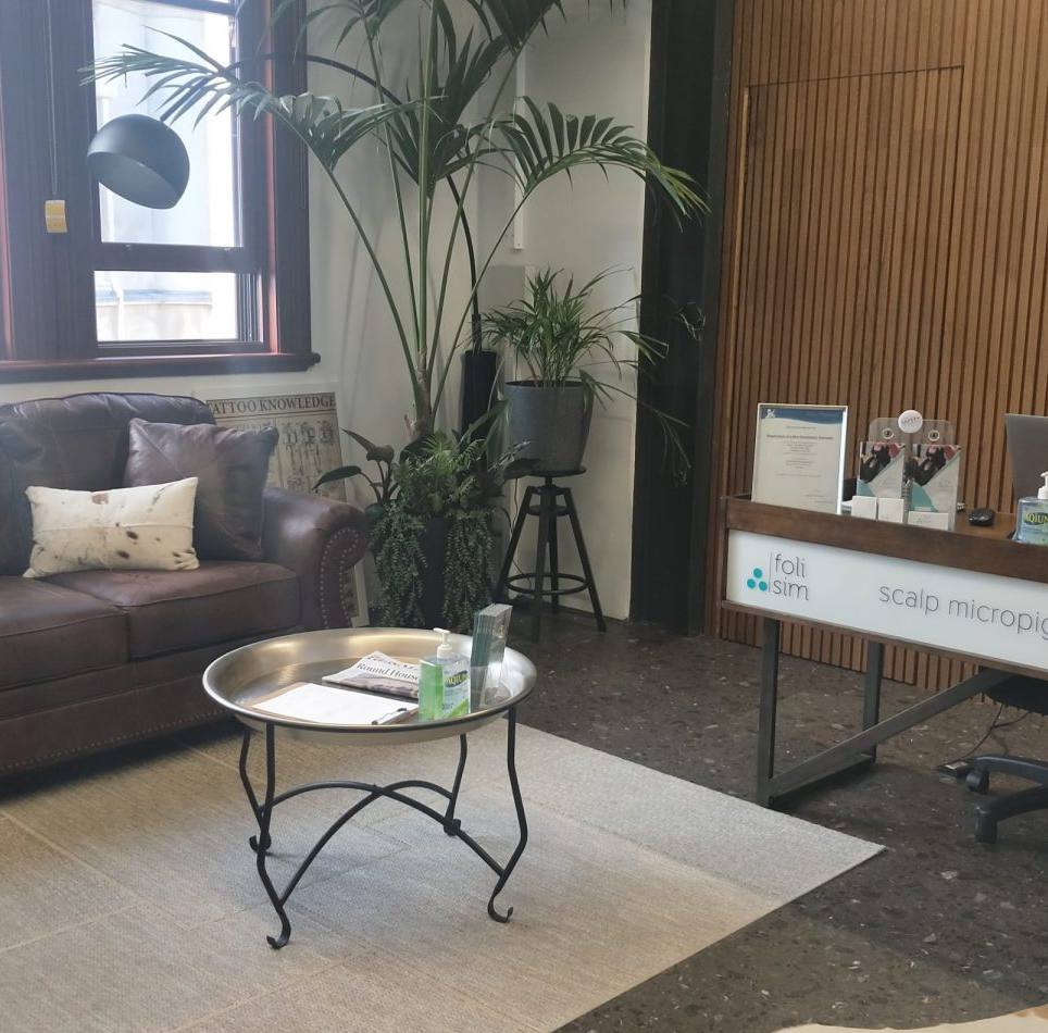 The reception and treatment area of a health department-certified Foli Sim SMP studio